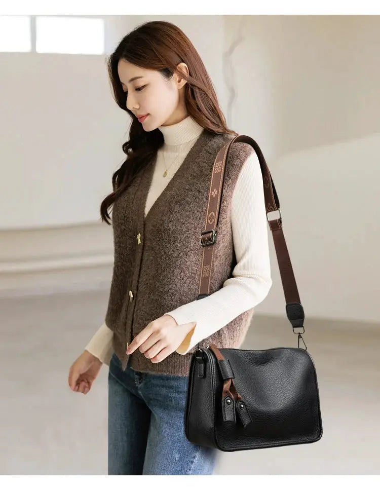 Leather crossbody bag by Simples Market, black genuine cowhide with brown adjustable strap.