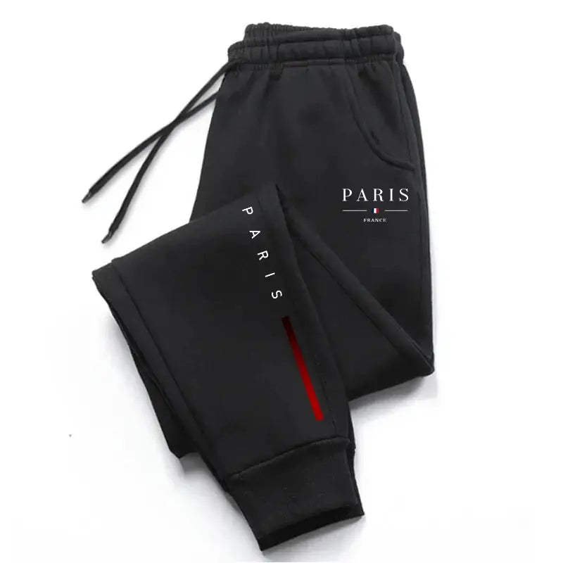 Men's Paris printed sweatpants by Simples Market, black joggers with Paris logo and red stripe.