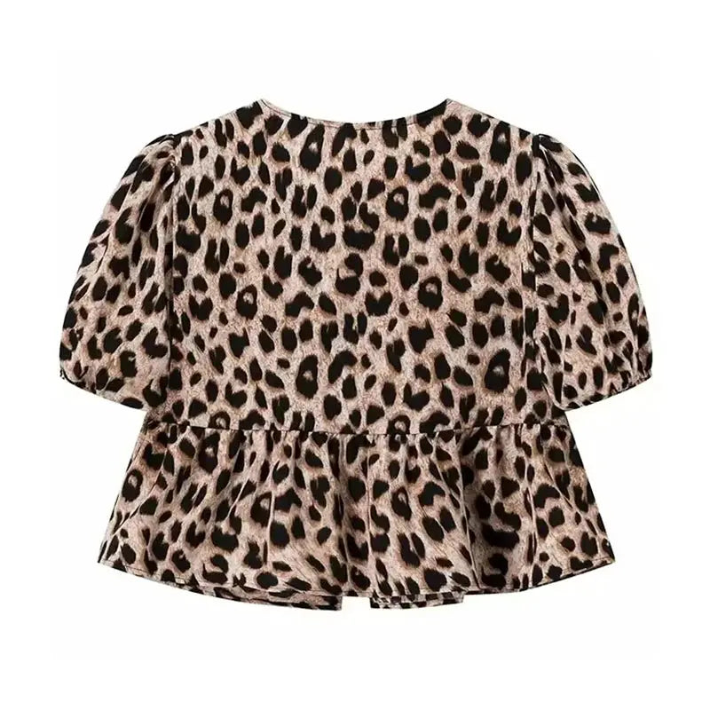 Leopard print puff-sleeve peplum blouse for women with a ruffled hem in tan and black spots
