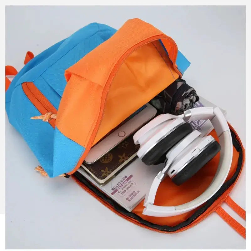 Outdoor lightweight small sports backpack in blue and orange with headphones and smartphone inside