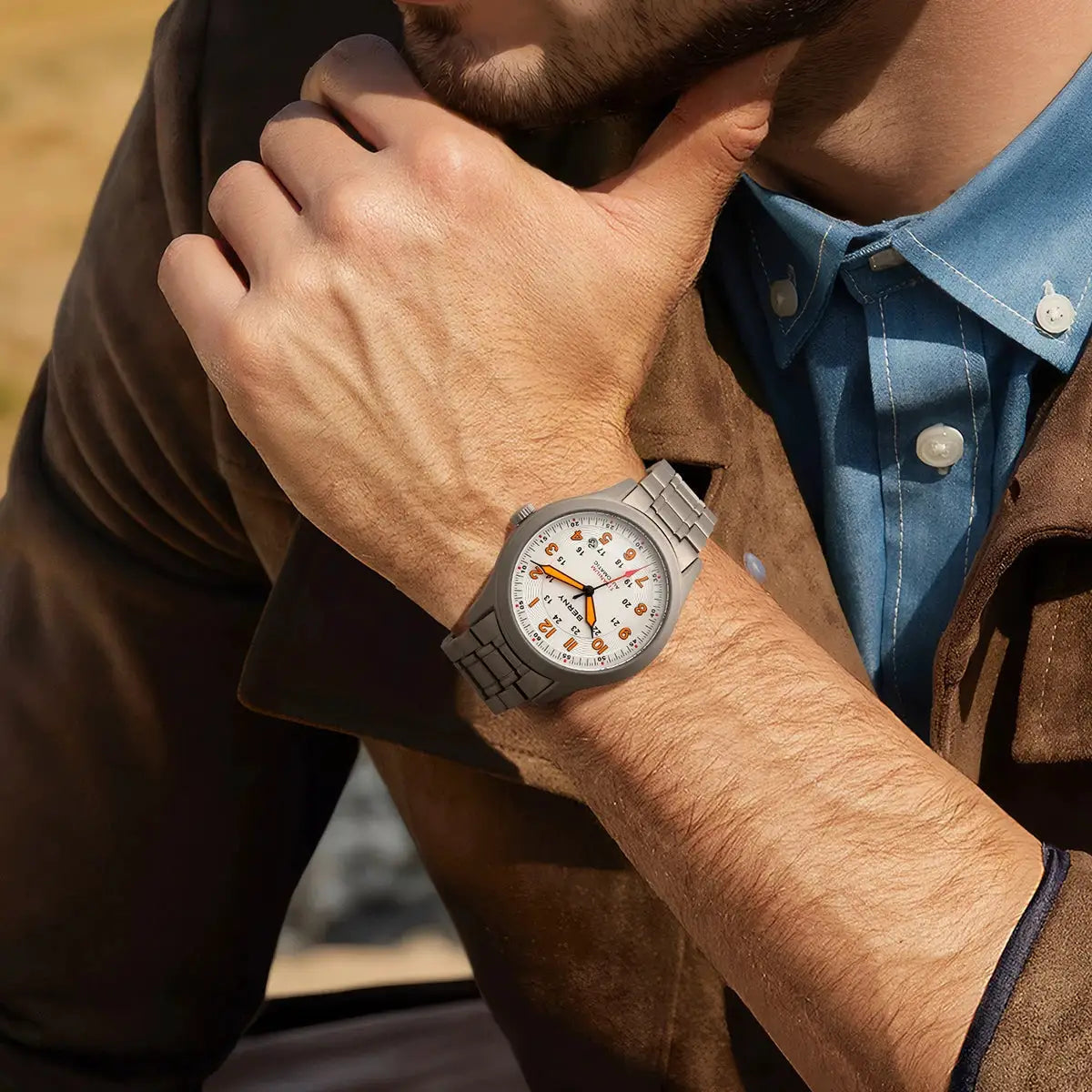 BERNY automatic full titanium men's watch with white dial and orange numerals on a metal bracelet