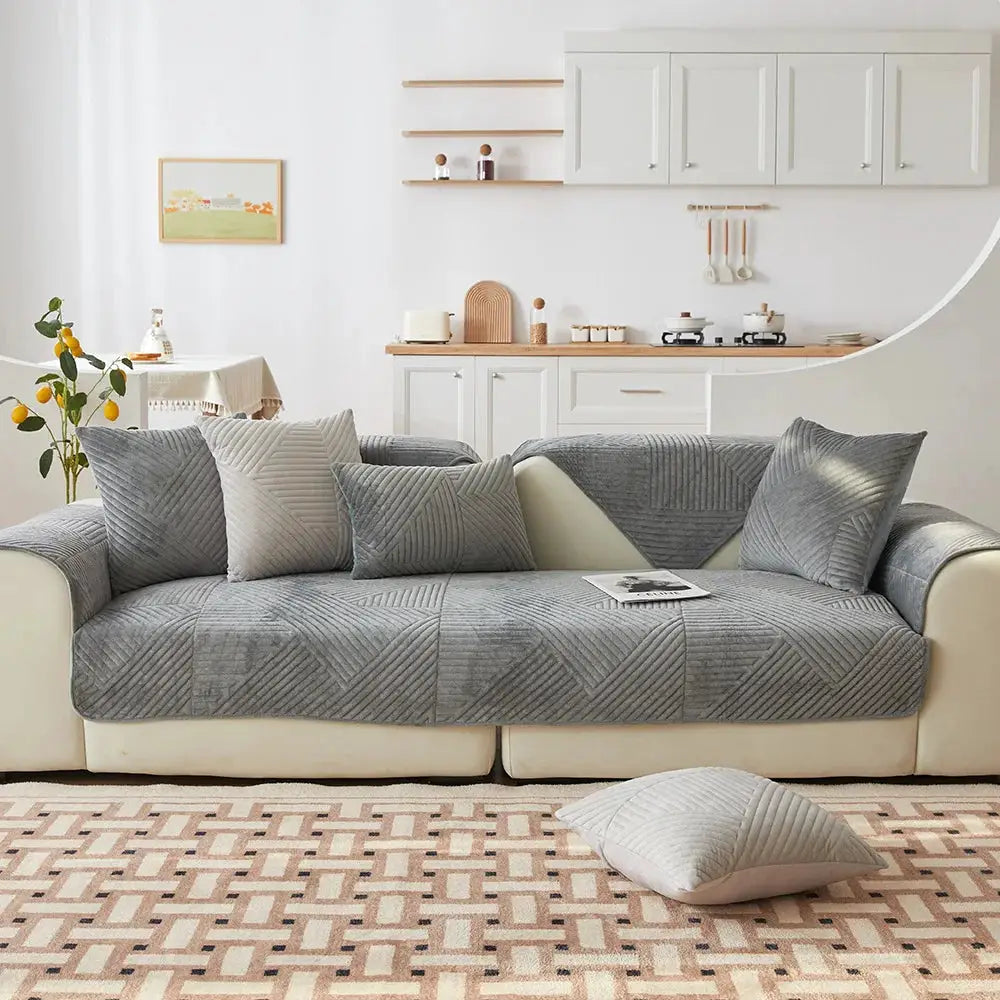 Simples Market crystal velvet sofa cover in gray with a quilted geometric pattern and non-slip fit on living room sofa.