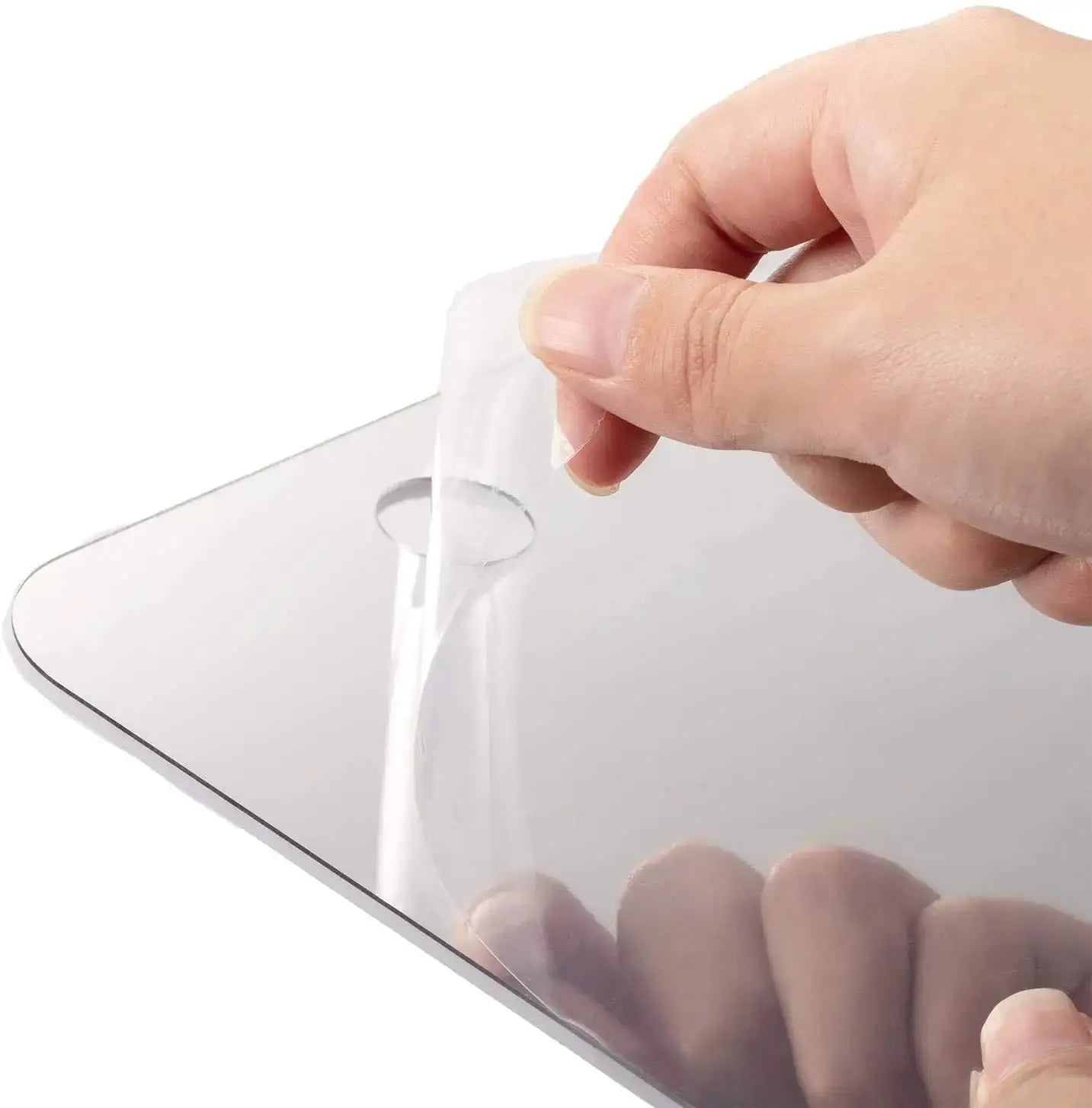 Acrylic fogless shower mirror by Simples Market with protective film being peeled