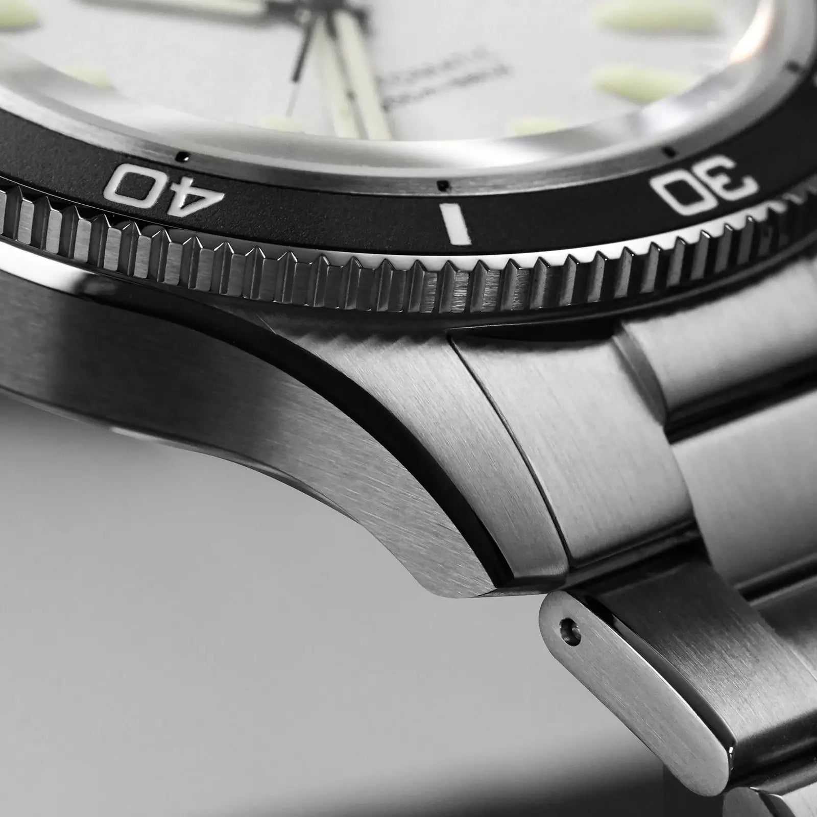 Watchdives Premier WD0019 automatic diver’s watch; stainless steel case and bracelet with black textured bezel.
