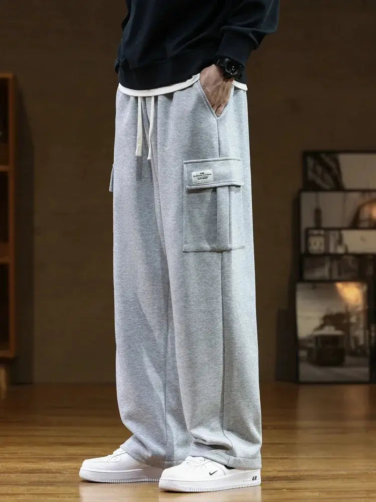 Men's gray cotton cargo sweatpants from Simples Market, with multiple pockets, drawstring waist, loose fit, size 8XL