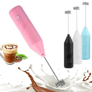 Handheld electric milk frother in pink, part of a 4-color set with black, white, and blue options for coffee