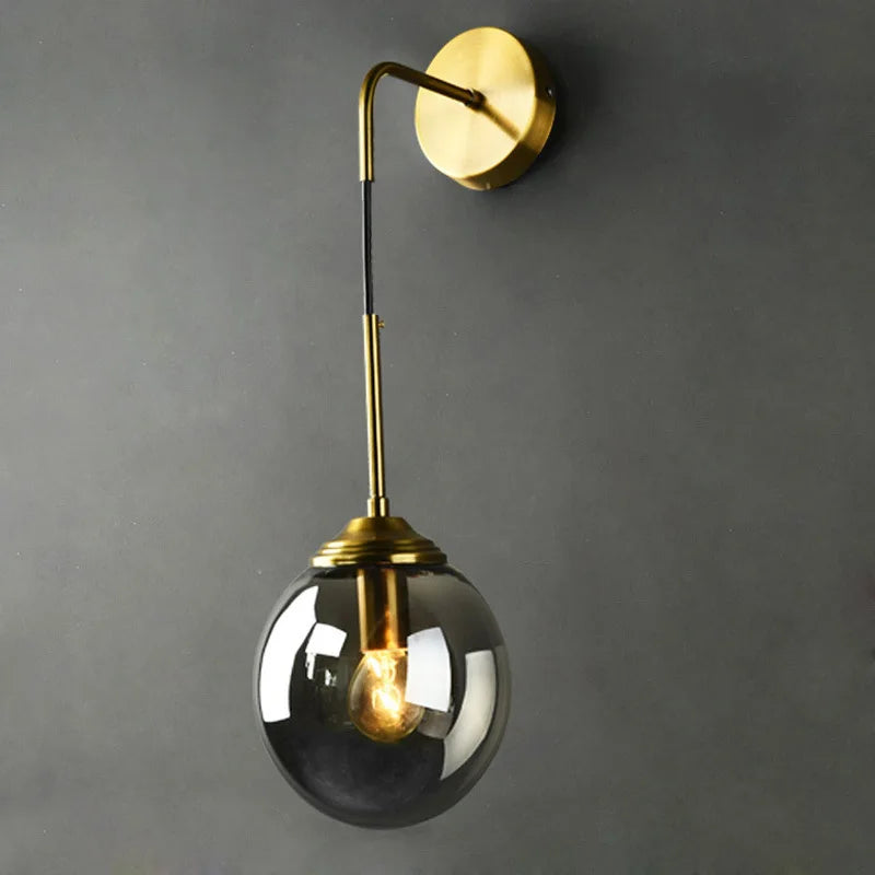Modern glass globe wall lamp sconce in brass finish