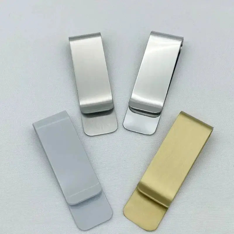 Four stainless steel money clips in silver, gray, and gold finishes