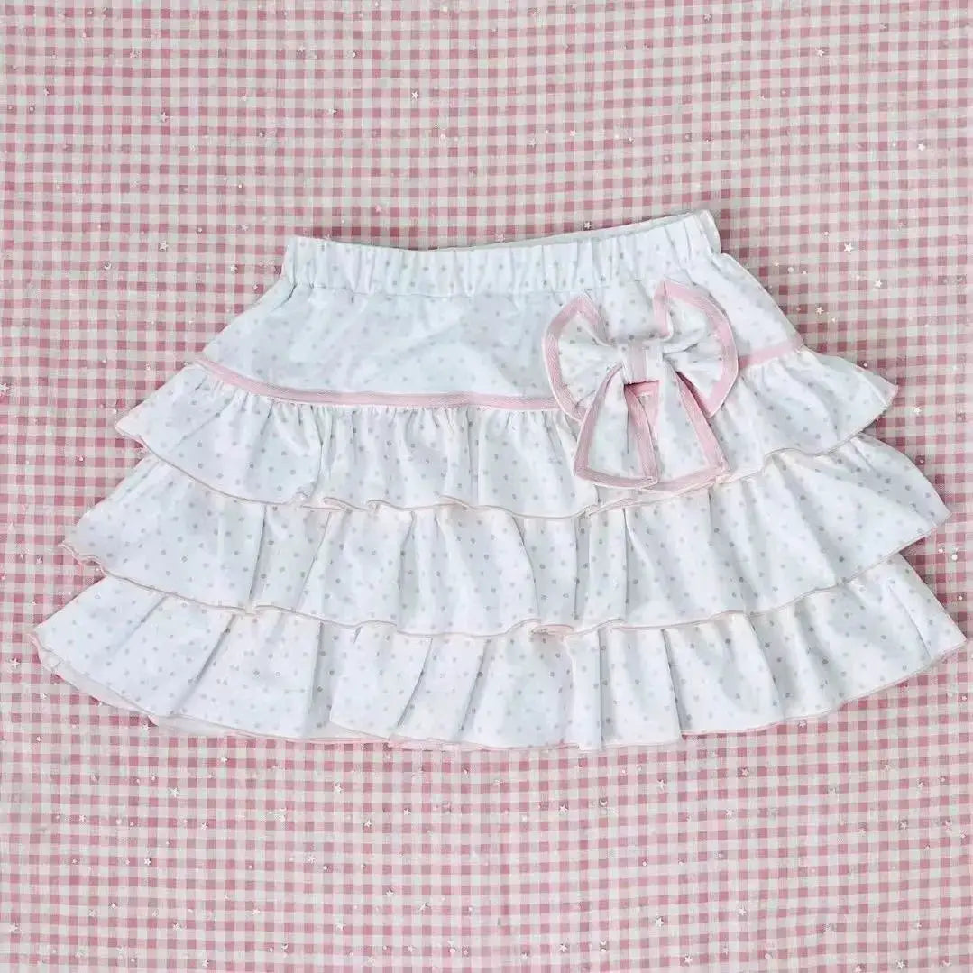 Simples Market Harajuku Girls Lolita mini skirt in white with pink bow, layered ruffles, and polka dots.