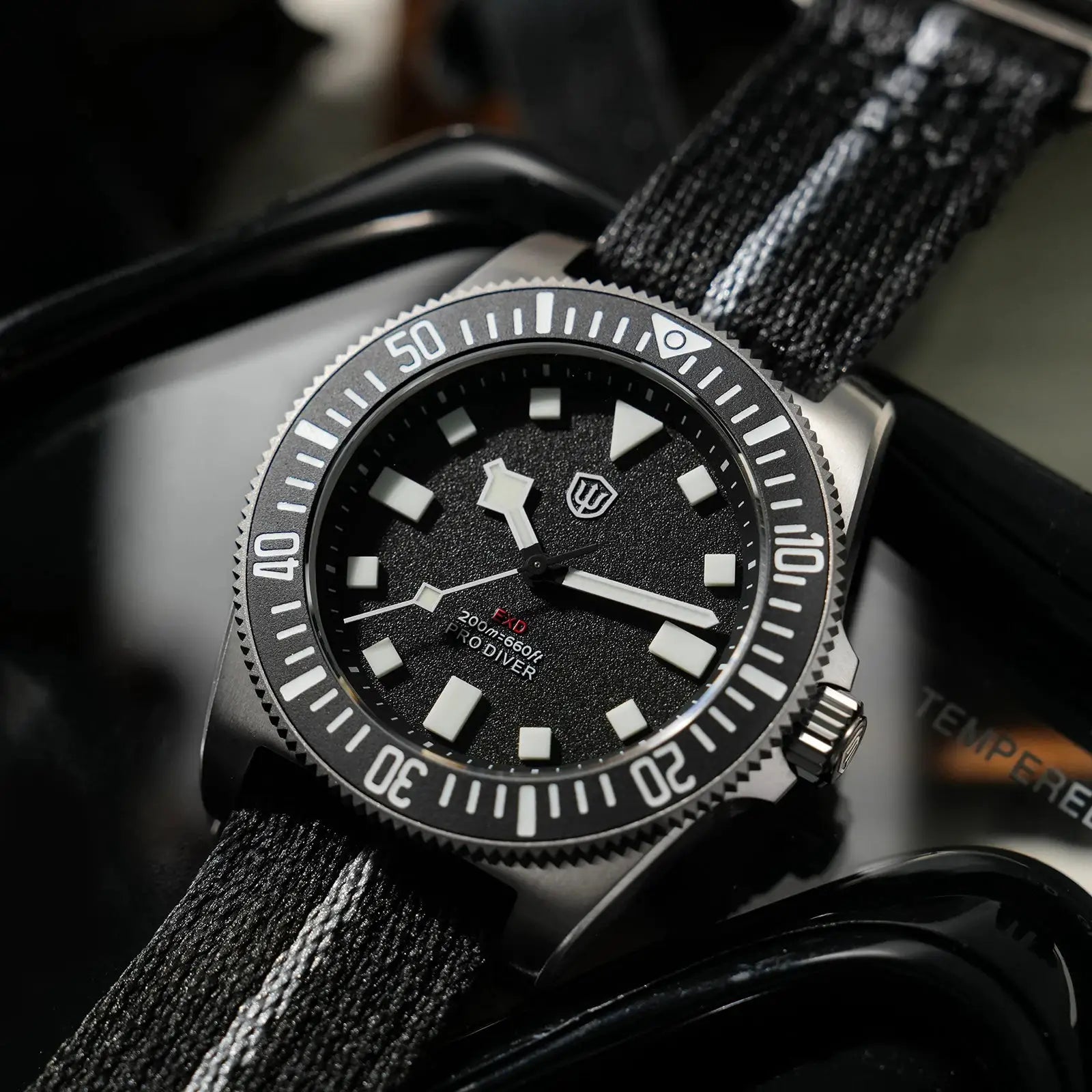 Watchdives EXD 40mm titanium dive watch with black dial, luminous markers, and fabric strap
