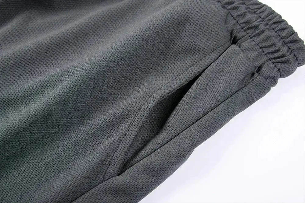 Men's gray sports shorts with elastic waistband and textured fabric