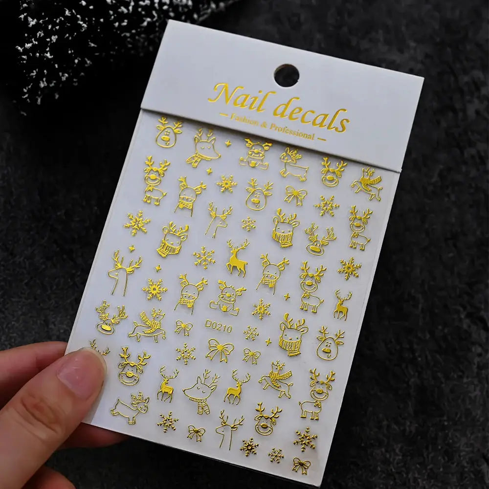 Winter Christmas nail decals by Simples Market; gold self-adhesive stickers featuring snowmen, reindeer, and snowflakes