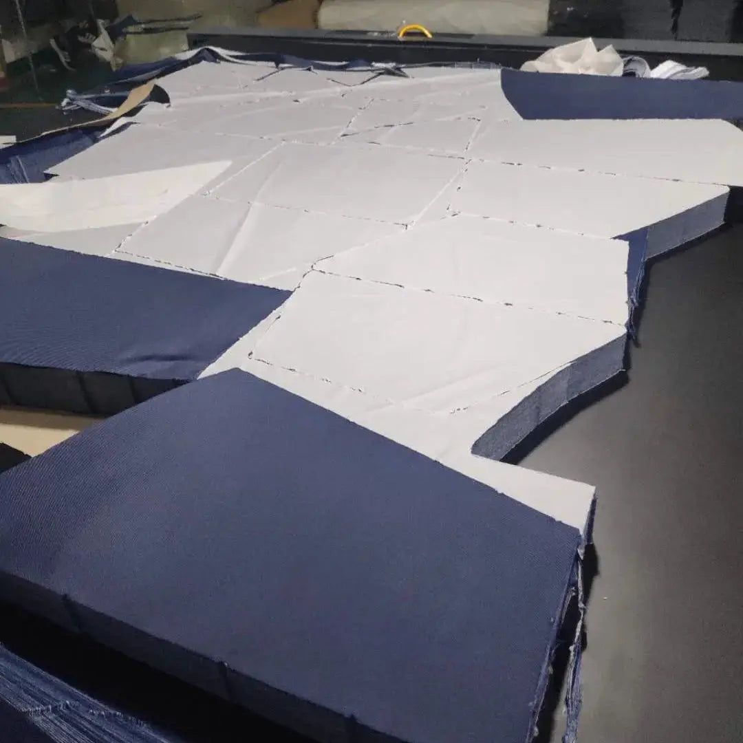 Jumpsuit packaging foam blocks in blue and white, stacked on a surface