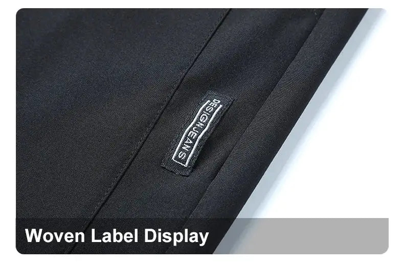 Running pants by Simples Market, black lightweight quick-dry fabric with a woven label patch