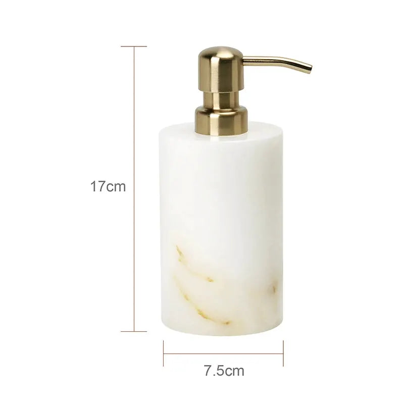 Soap dispenser by Simples Market in white onyx marble with a gold pump