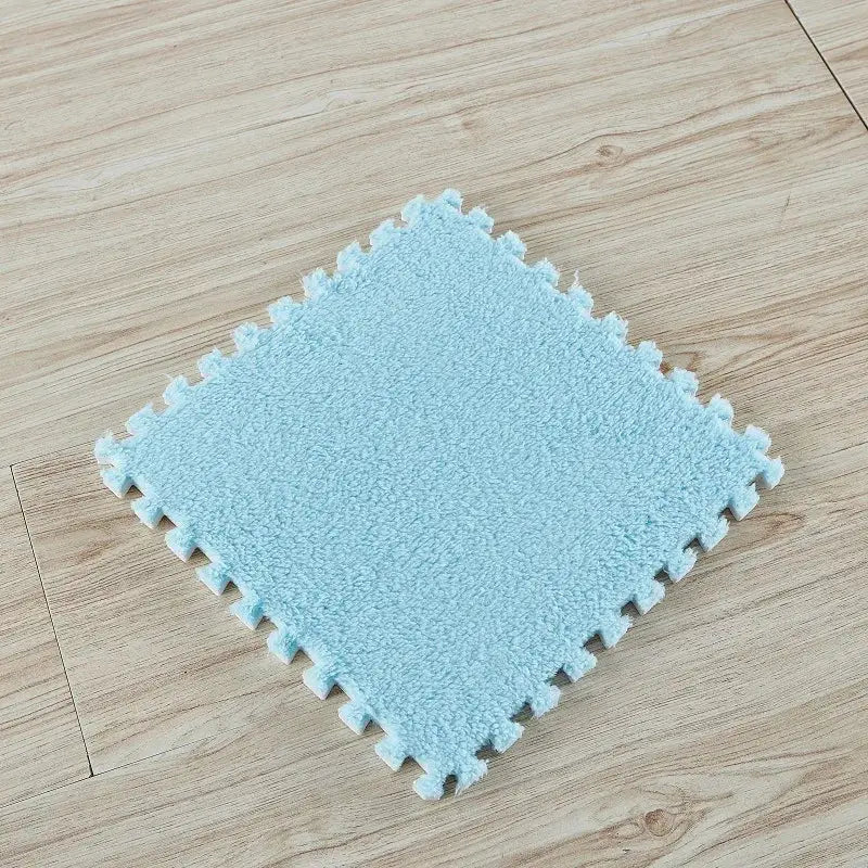 Blue 30x30 cm interlocking foam puzzle floor mat tile on wooden floor