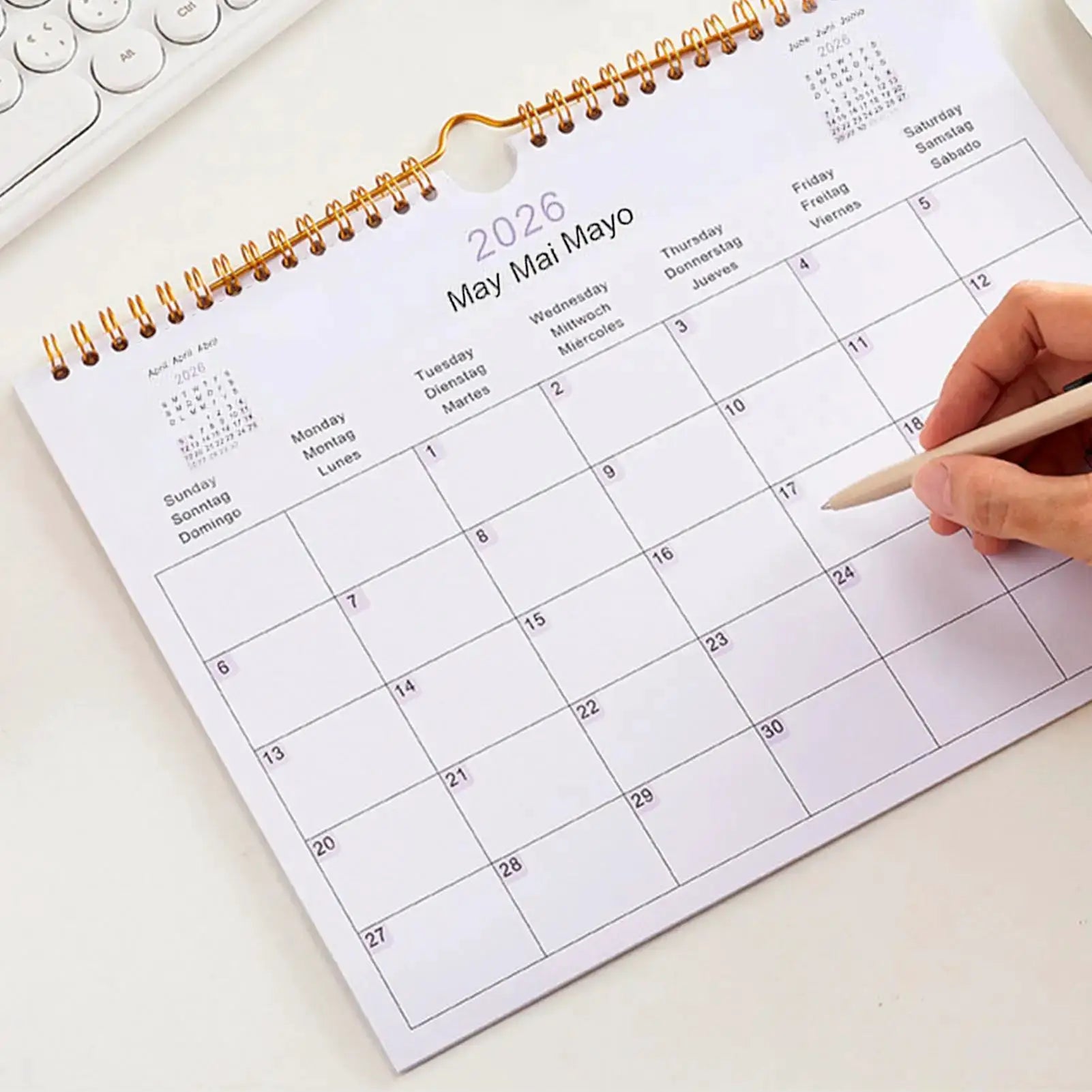 2026 multilingual wall calendar with orange coil binding; 12-month planner page for May 2026.