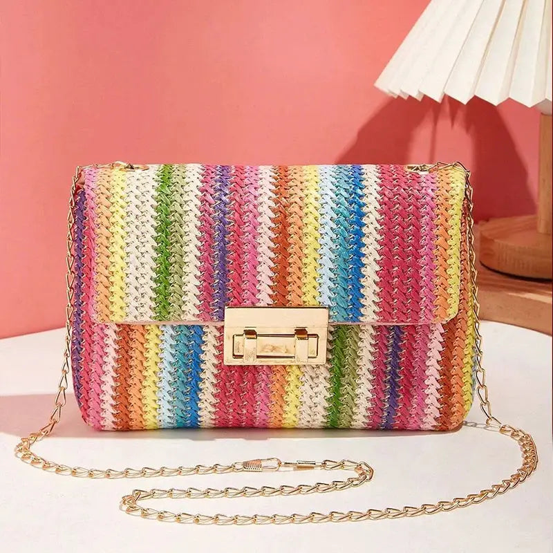 Crossbody bag for women with rainbow striped woven texture, gold-tone hardware, and a gold chain strap
