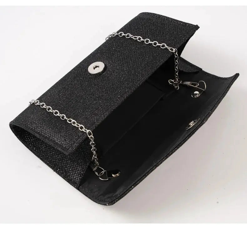 Women envelope evening bag in black glitter with silver chain strap