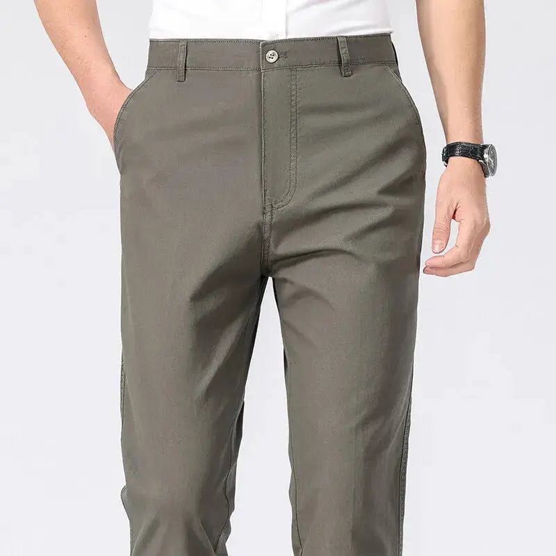 Men's olive chino pants, lightweight business casual dress trousers with pockets.