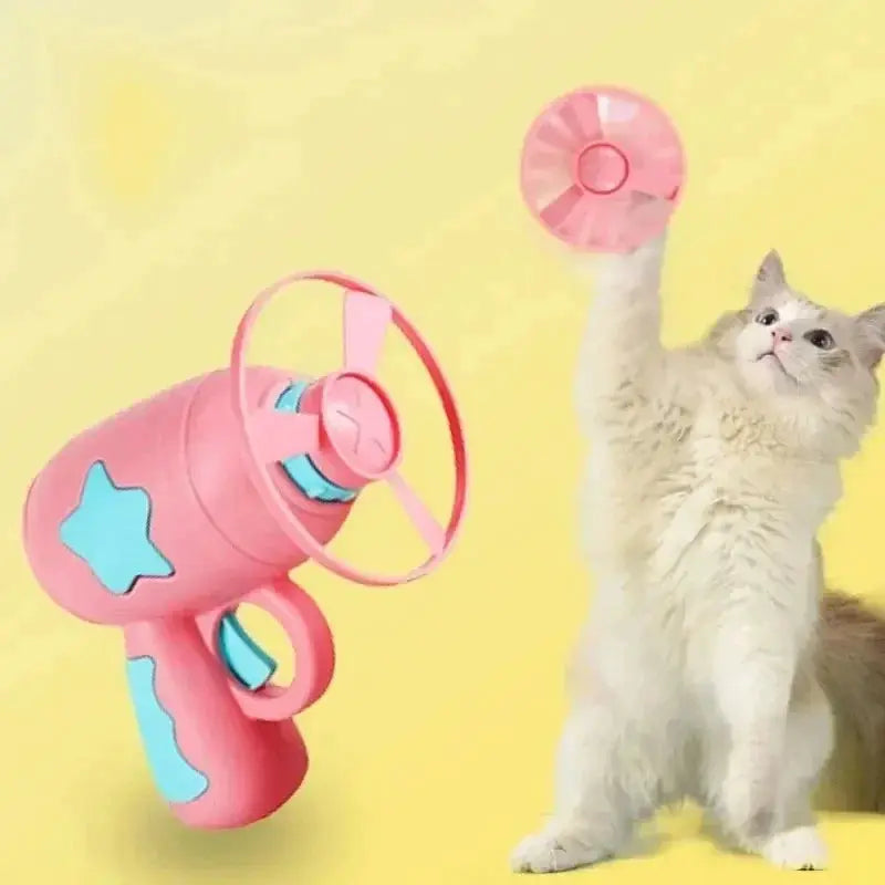 Funny cat toy interactive launch gun in pink with blue accents launching a flying disc