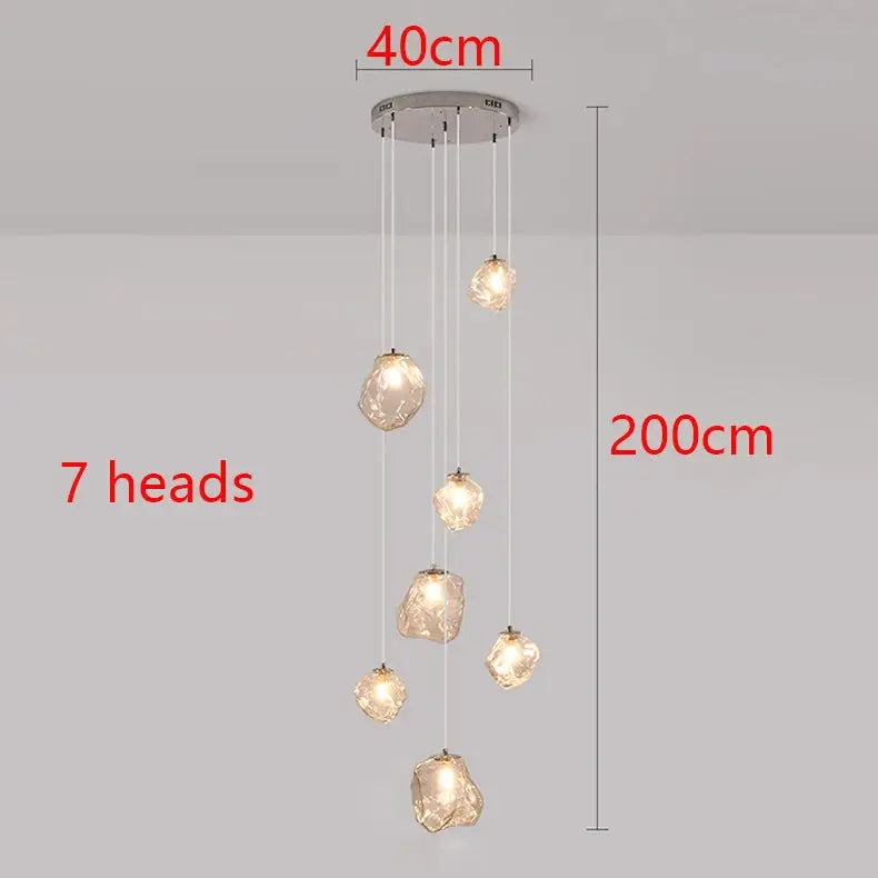 Pendant light by Simples Market, 7 crystal-style glass heads, 40 cm wide, 200 cm drop.