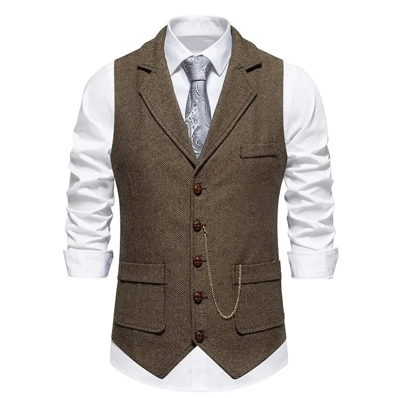 Men's brown herringbone tweed lapel vest with pocket chain, worn over white shirt and tie