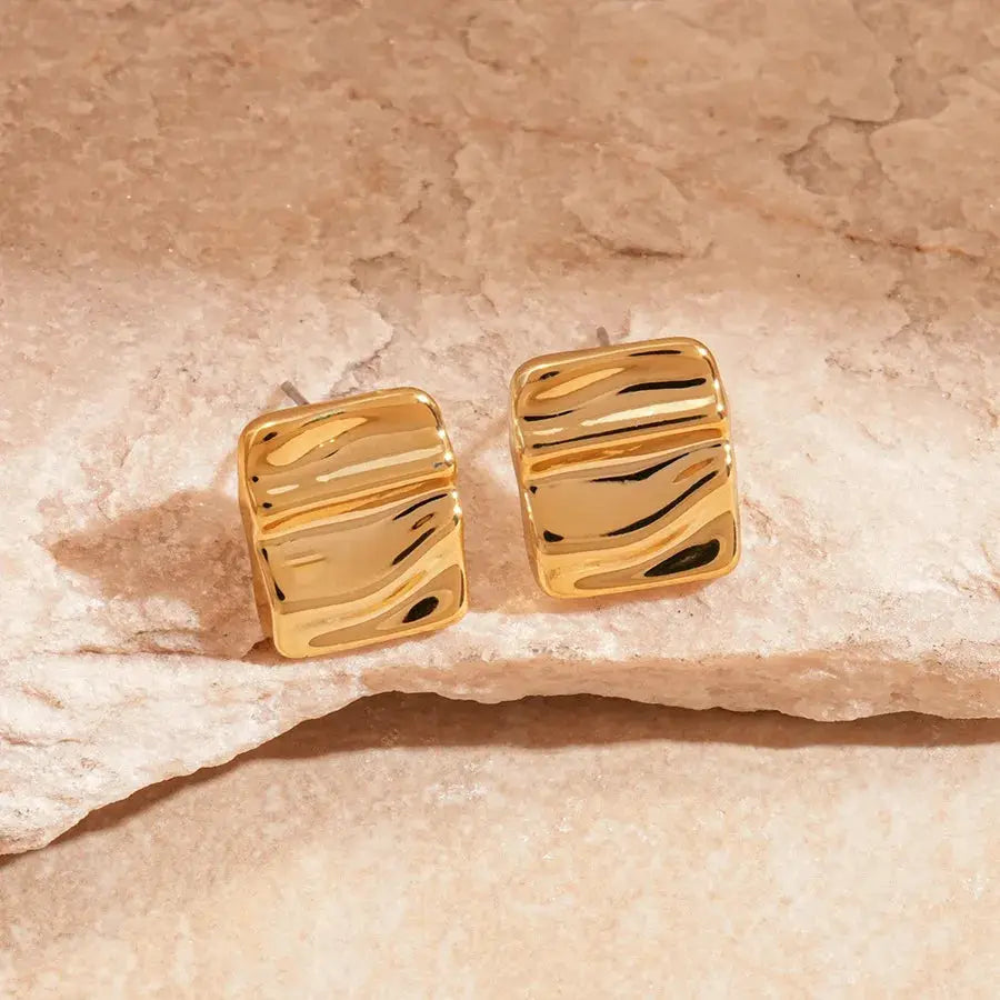 Gold-tone irregular pleated oval acrylic square stud earrings, pair.