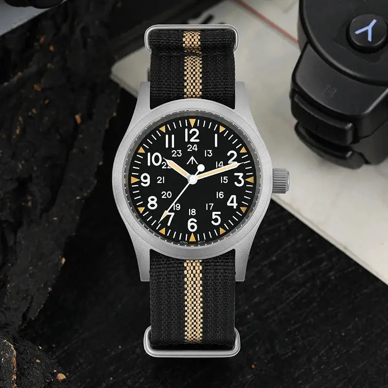 Militado ML05 vintage watch with 38mm grey steel case, black dial, and tan center-stripe fabric strap