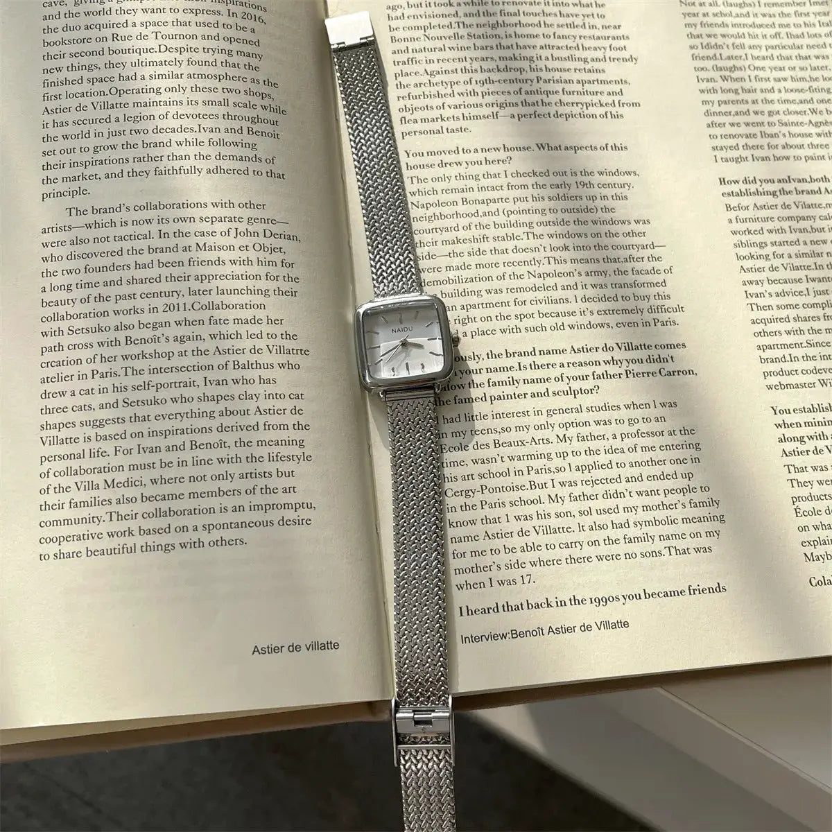 Women's quartz wristwatch with a square silver dial and stainless steel mesh strap