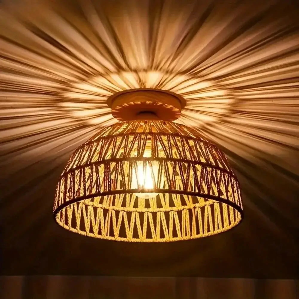 E27 wicker pendant lamp with a natural hand-woven shade and warm amber glow