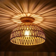 E27 wicker pendant lamp with a natural hand-woven shade and warm amber glow