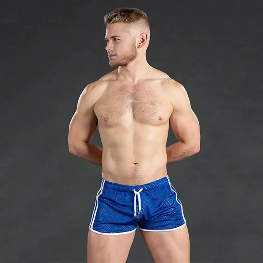 Men's blue hollow-mesh sport shorts with drawstring waist, quick-dry fabric