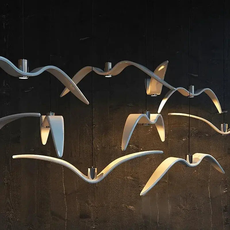 Simples Market modern seagull-design LED pendant lamp with curved white ribbons for bar or kitchen chandelier.