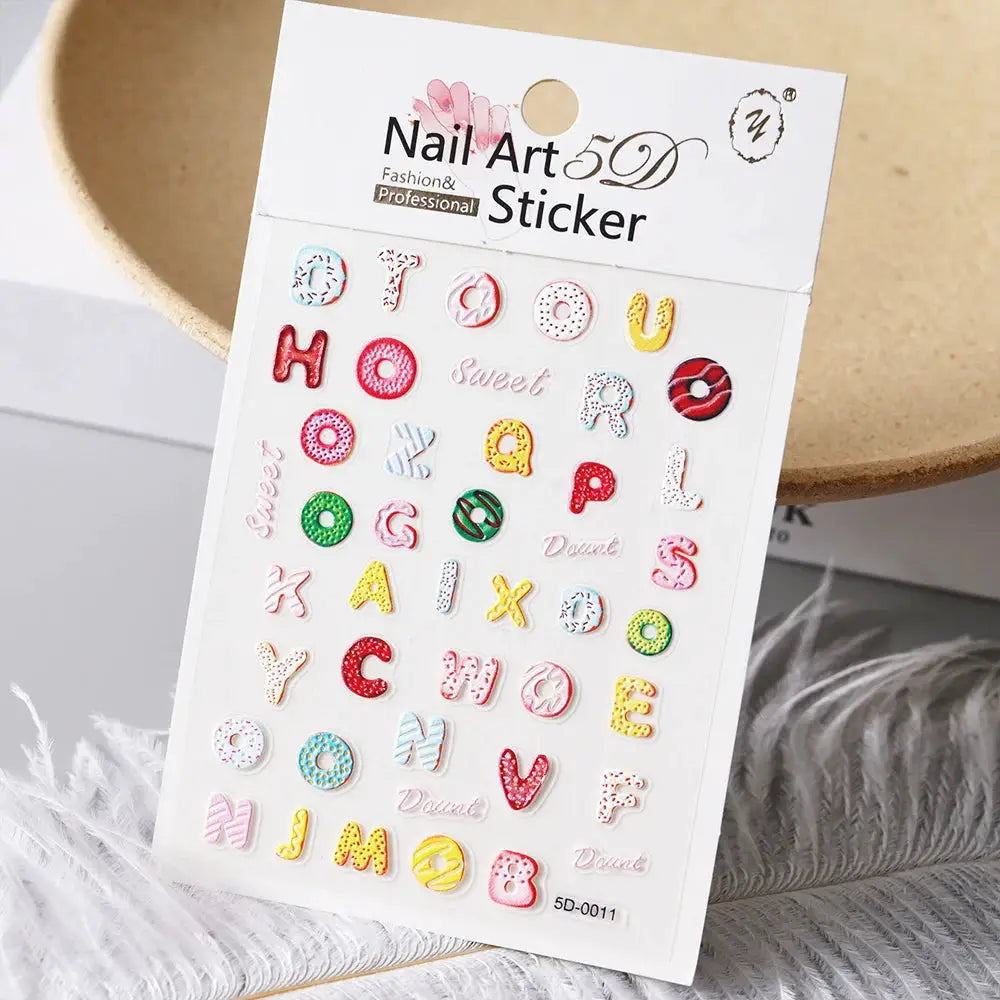 Simples Market nail art sticker sheet with colorful 5D alphabet letters and donut-style accents for nails