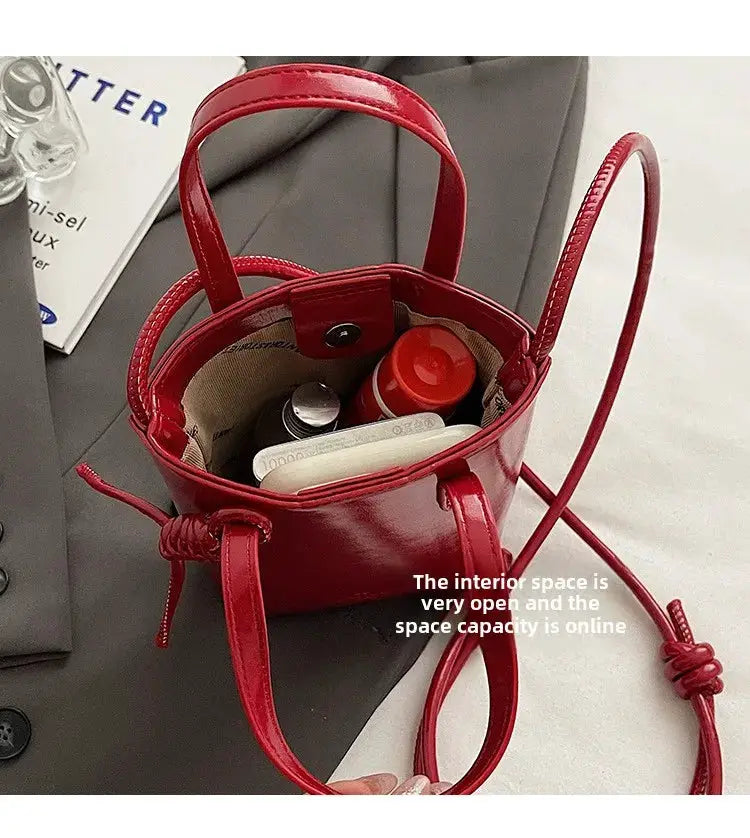 PU leather mini crossbody bag in red with top handles and long strap