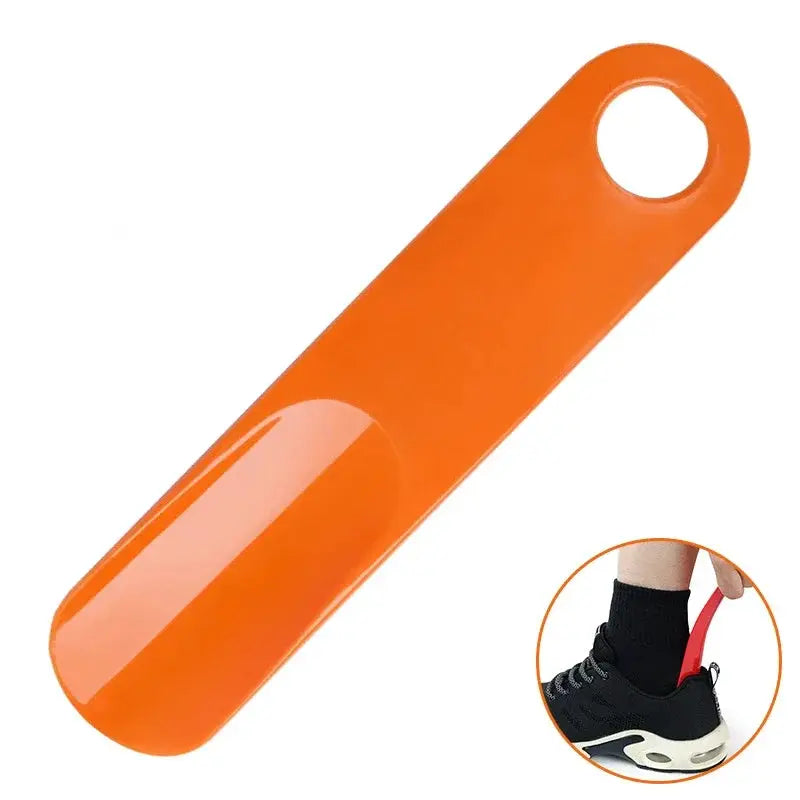 Shoe horn by Simples Market, orange plastic spoon-shaped lifter for easy slip-on footwear