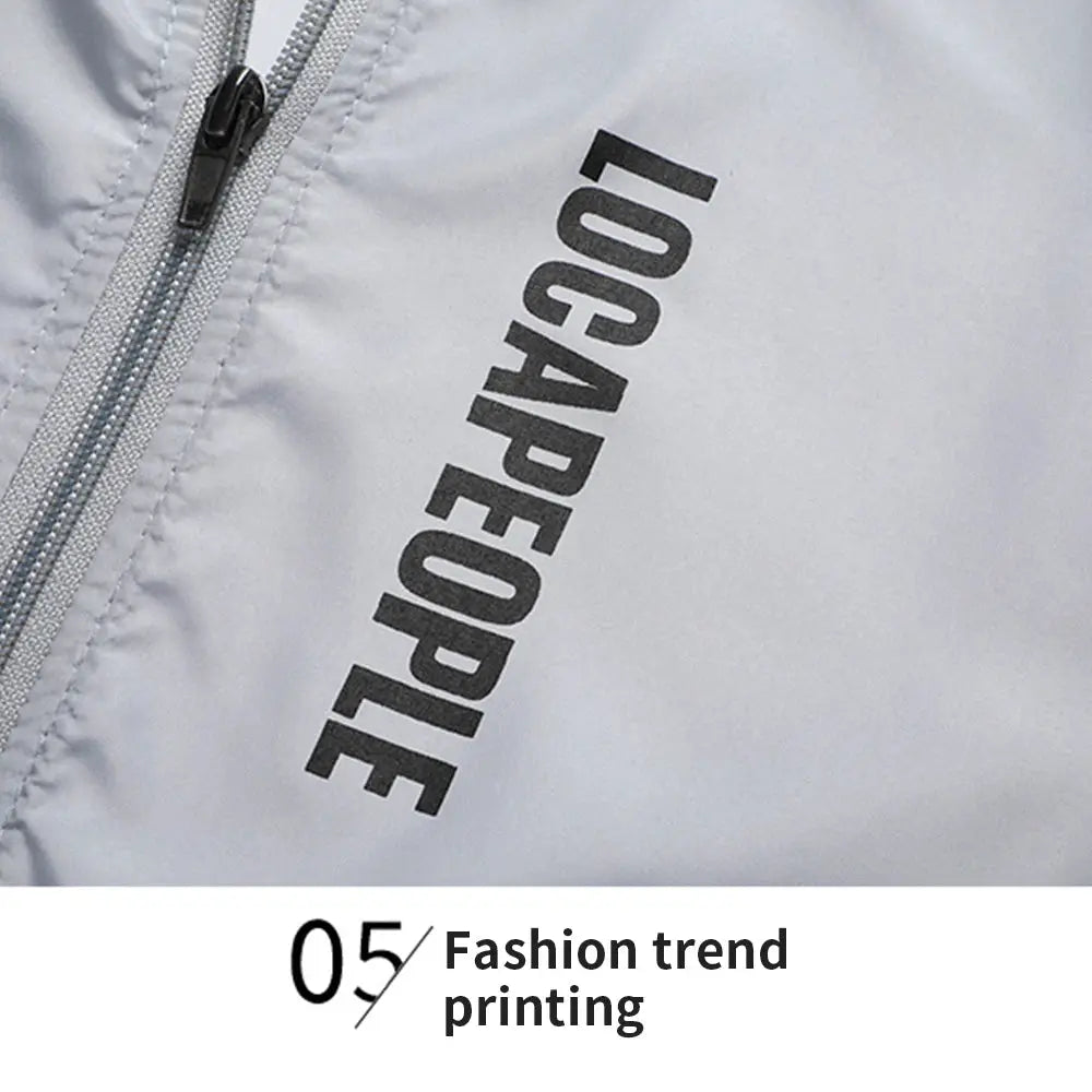 Sun protection men's cycling jacket in light gray with diagonal black print and front zipper, long sleeves.