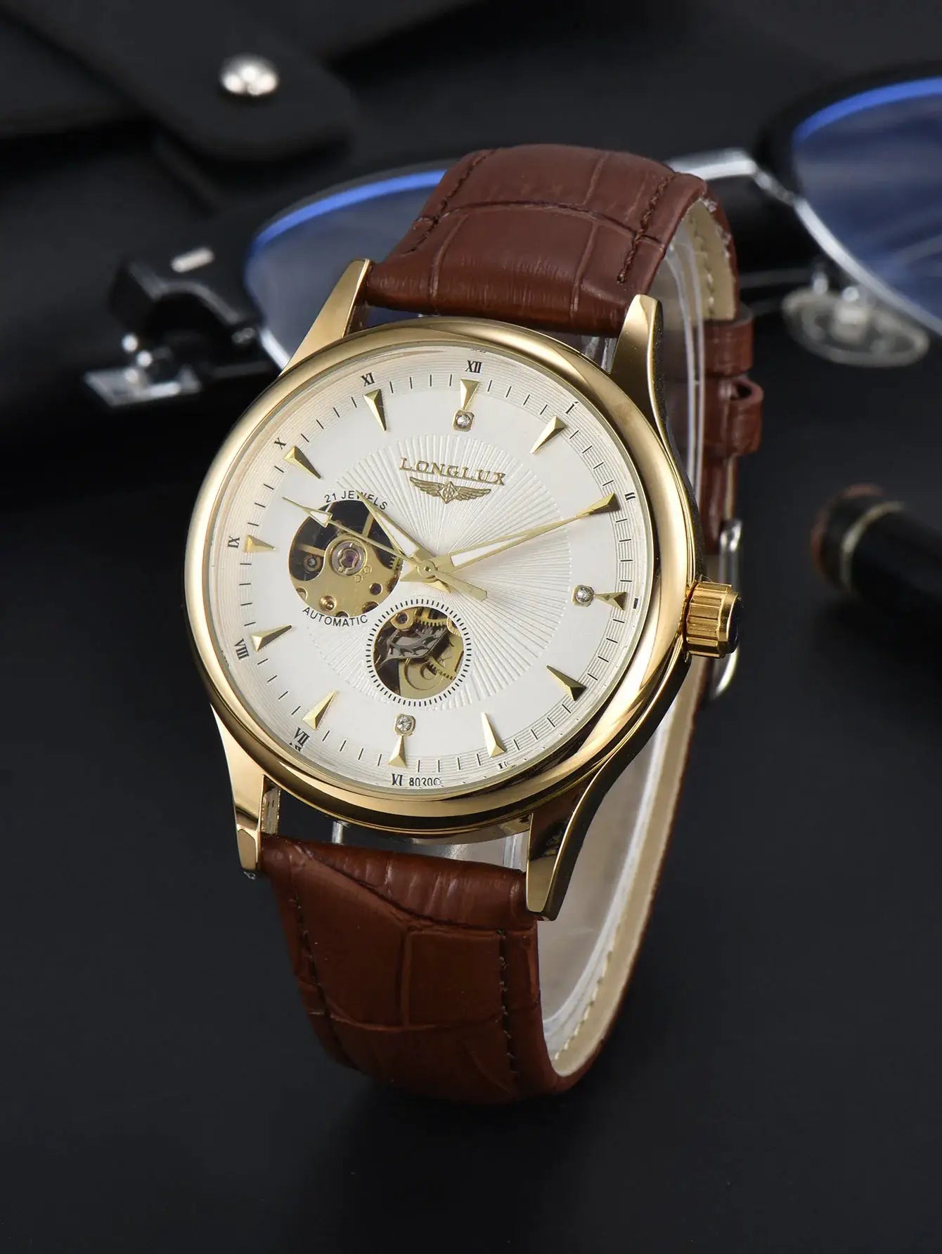 LONGLUX automatic wristwatch with gold-tone case, white dial, Roman numerals, open-heart skeleton, brown leather strap