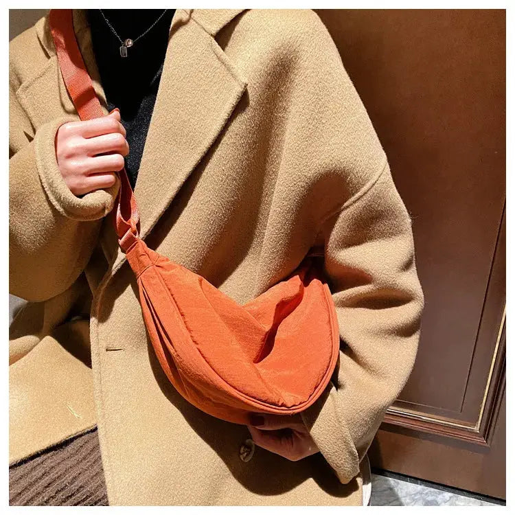 Casual orange nylon hobo crossbody bag for women with a long shoulder strap