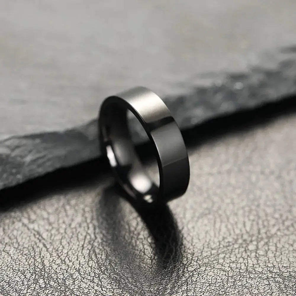 Unisex stainless steel ring with black matte finish; bold minimalist fashion jewelry for men and women.