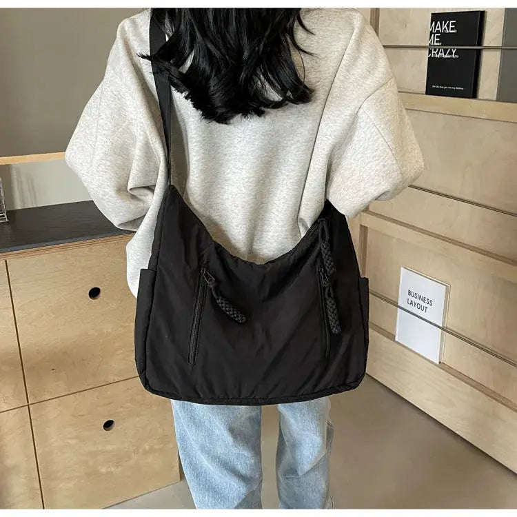 Trendy women's soft cloth shoulder bag by Simples Market, solid black, crossbody with front zip pockets
