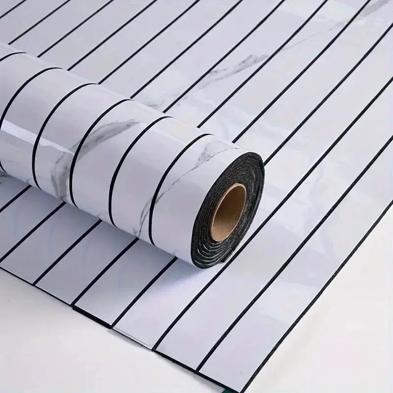 Self-adhesive wallpaper roll with white marble texture and bold black vertical stripes