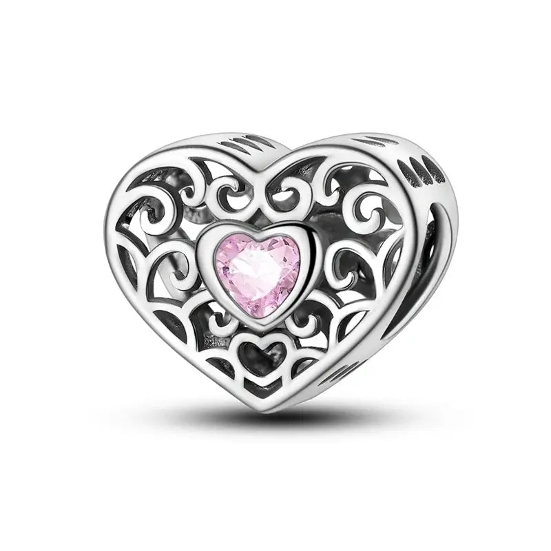 Silver-plated heart charm with pink zircon centerpiece and intricate filigree for Qikaola 925 bracelets by Simples Market