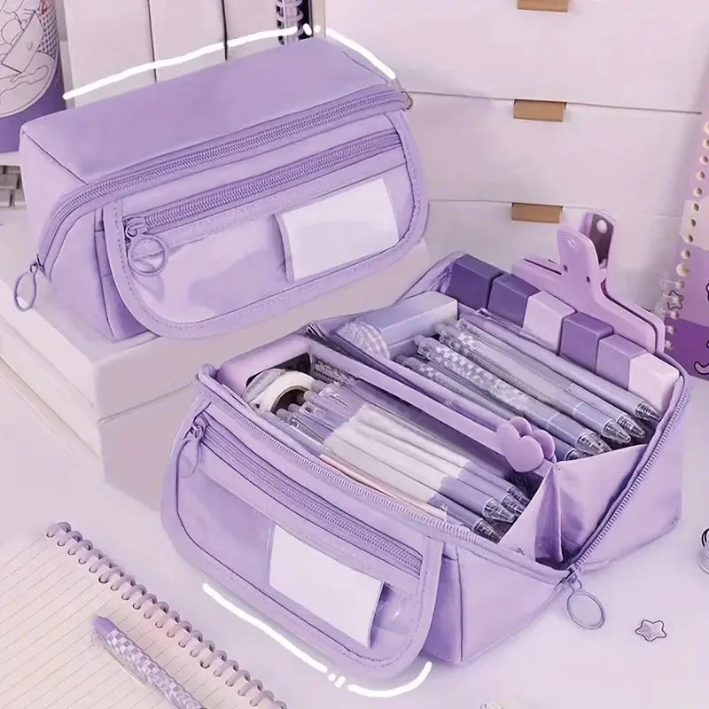 Two lavender pencil cases by Simples Market; large-capacity, multi-compartment storage with transparent front pockets.