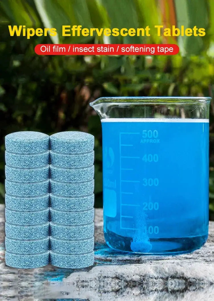 Simples Market windshield washer tablets, blue effervescent car glass cleaner, stacked beside a blue measuring beaker