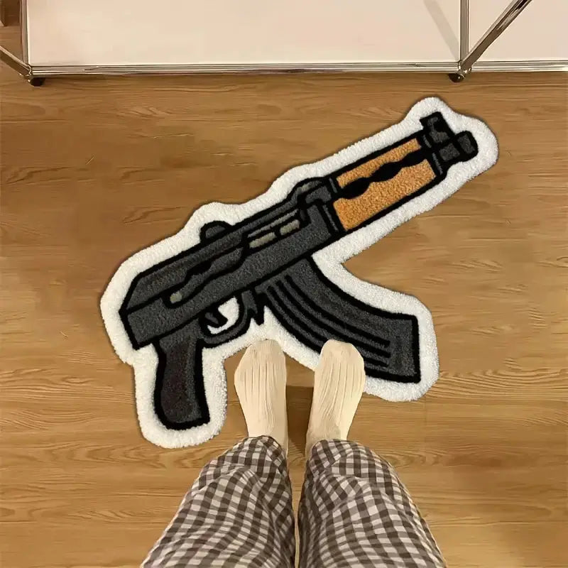Rifle-shaped cartoon rug with black body, brown stock and white border on wood floor