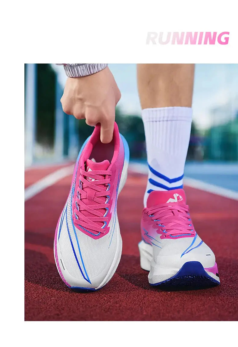 Running shoes pink and white with blue accents on track, breathable mesh upper