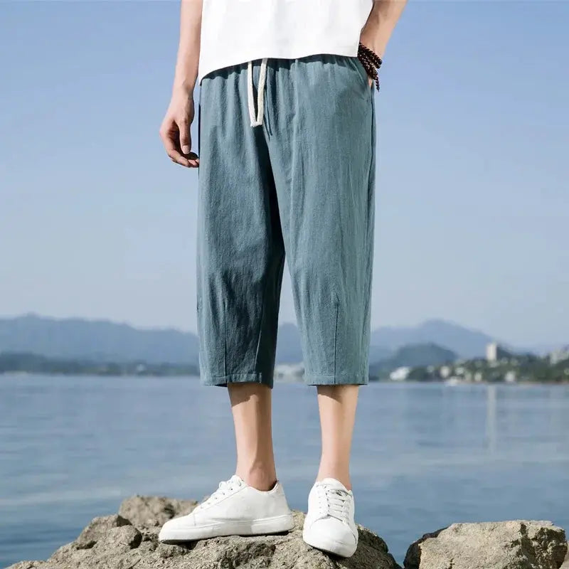 Men's summer casual shorts, light blue with white drawstring, mid-calf length