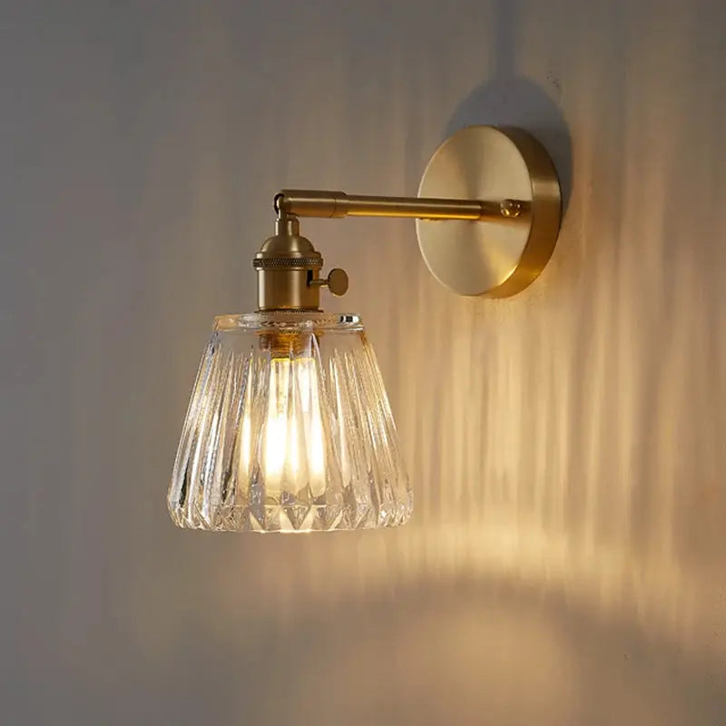 Brass glass wall lamp sconce by Simples Market with ribbed glass shade